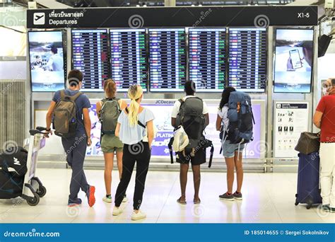 Bangkok Suvarnabhumi Airport Passengers Look At The Departure Board