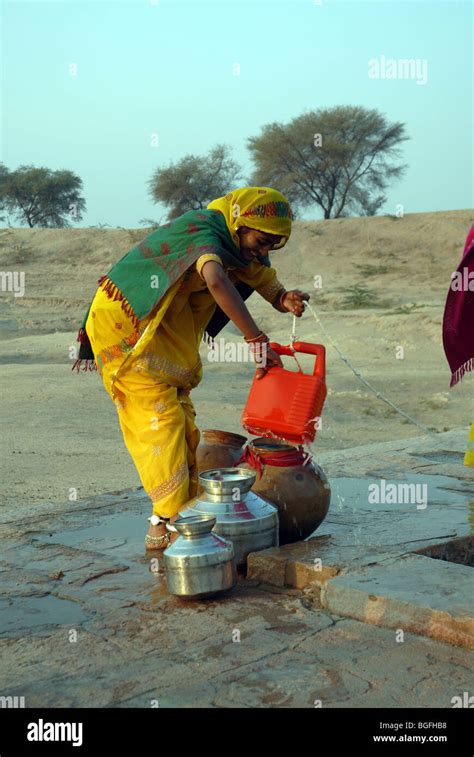 Rajasthan Women Getting Water From Well Stock Photo Alamy