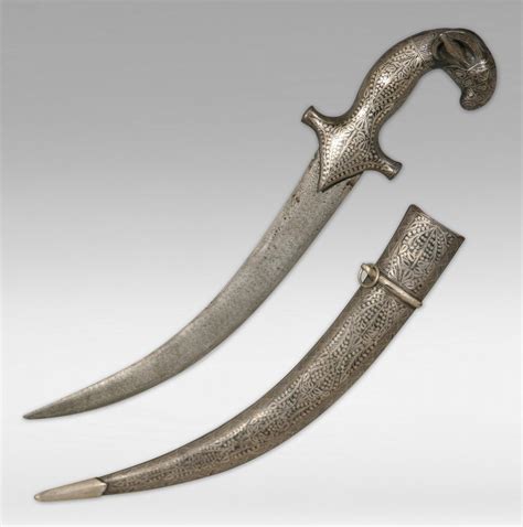 Three Persian Silver Inlaid Daggers