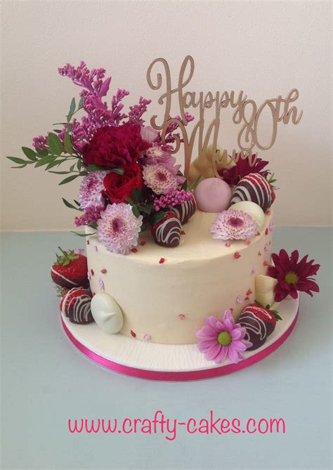 Pretty 80th Birthday Cake Covered In Buttercream With Fresh Flowers And