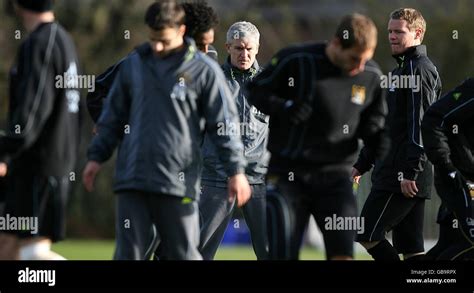 Manchester City Manager Mark Hughes Watches His Players During Training