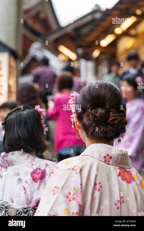 Japanese Women Wear A Traditional Dress Called Kimono For Sakura