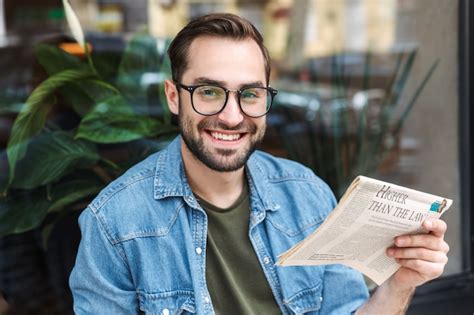 Premium Photo Cheerful Young Man Wearing Eyeglasses Smiling And