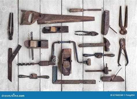 Collection Of Antique Woodworking Tools On Wooden Table Stock Photo