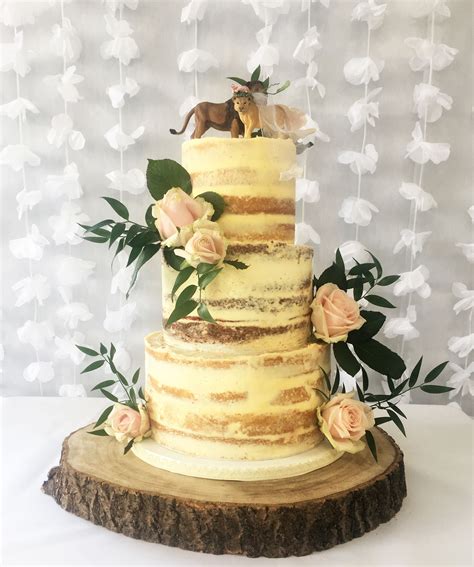 Semi Naked Wedding Cake With Lion Toppers Naked Wedding Cakes