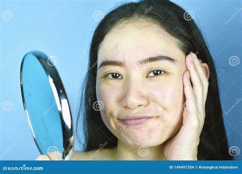 Asian Woman Looking At Herself In The Mirror Female Feeling Annoy