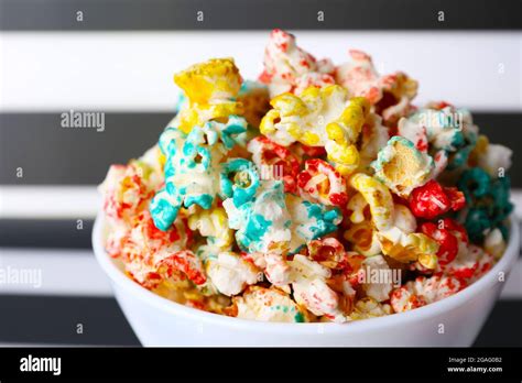 Sweet Colourful Popcorn On Striped Black And White Background Stock