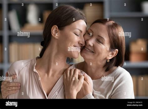 Happy Adult Daughter And Mature Mother Hugging Expressing Love Stock Photo Alamy