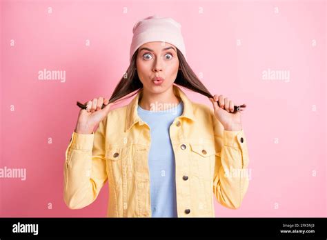 Portrait Of Adorable Person Arms Hold Hair Tails Kiss Lips Wear Cap