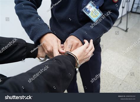 Police Officer Handcuffs Suspect Stock Photo 2090701222 | Shutterstock