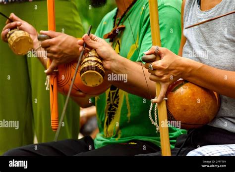 Musicians Playing An Afro Brazilian Percussion Musical Instrument