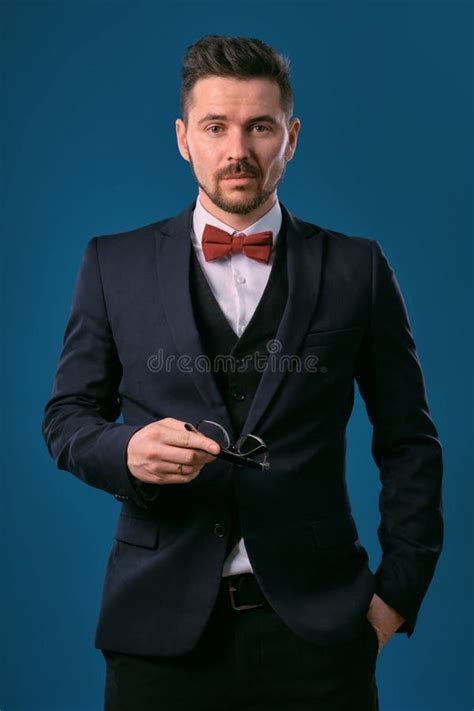 Young Business Man In Classic Black Suit White Shirt Red Bow Tie And