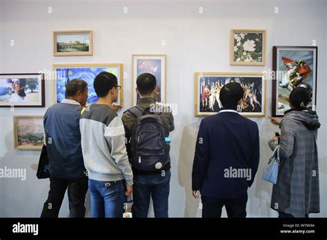 Visitors look at digital photo frames of BOE Technology Group on ...