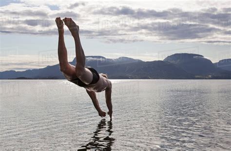 Man Diving Into Water Aure Norway Stock Photo Dissolve