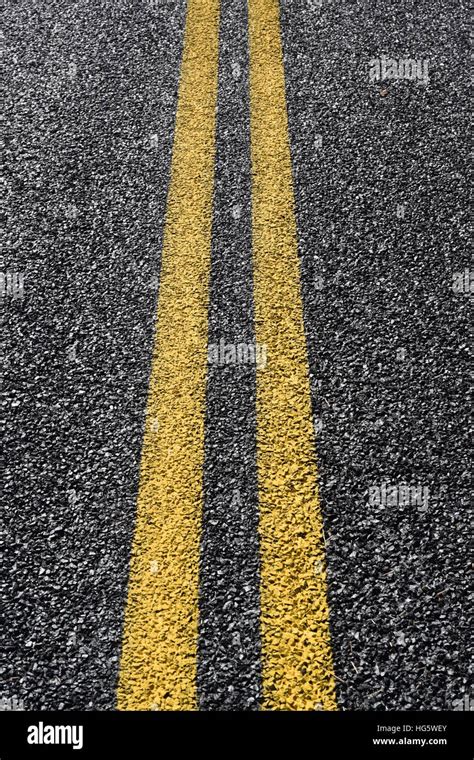 Double yellow line Stock Photo - Alamy