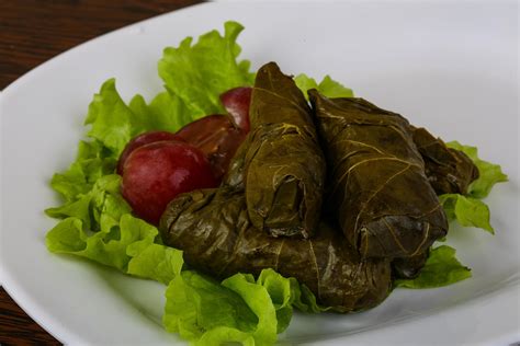 Dolma On The Plate And Wooden Background 12531371 Stock Photo At Vecteezy