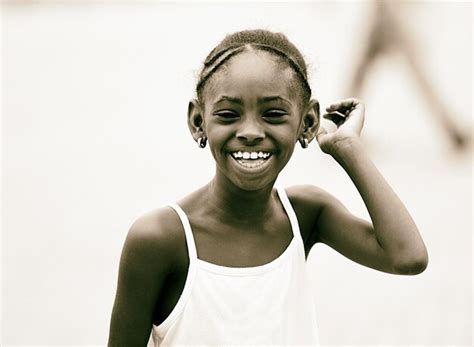 Premium Photo Portrait Of Smiling Girl Standing Outdoors