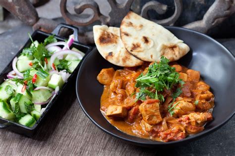 Recipe Chicken Tikka Masala With Minted Cucumber Salad Naan Blue Apron