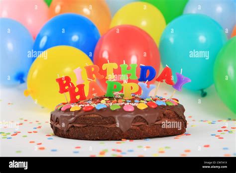 Happy Birthday Chocolate Cake With Candles And Balloons Stock Photo