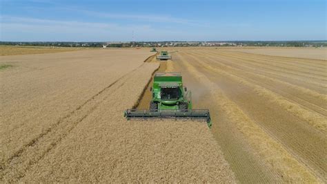 Premium Photo Combine Harvester At Work Harvesting Field Wheat Aerial