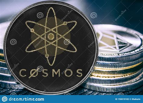 Coin Cryptocurrency Cosmos Atom On The Background Of A Stack Of Coins