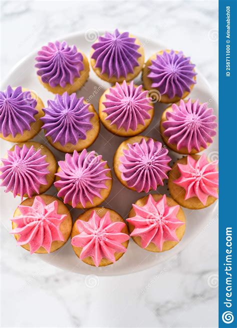 Mini Vanilla Cupcakes With Pink Buttercream Frosting Stock Photo