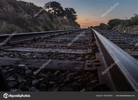 Parallel Train Tracks Lead Horizon Dawn Begins Light Morning Sky