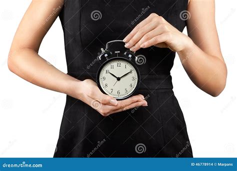 Woman Holding Alarm Clock In Hands Isolated On White Stock Photo