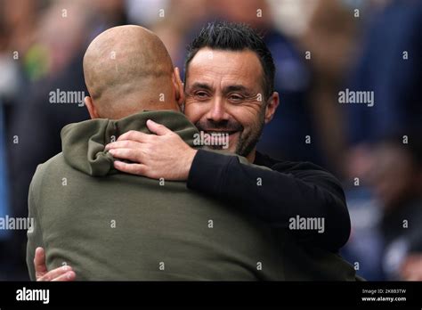 Brighton And Hove Albion Manager Roberto De Zerbi Right And Manchester City Manager Pep