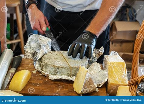 Sellerand X27 S Hands Cut Off A Piece Of Cheese Russian Farmerand X27 S