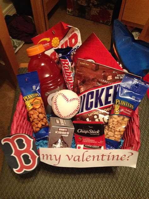 A Basket Filled With Snacks And Condiments On Top Of A Carpeted Floor