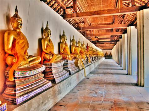 Row Of Golden Buddha Statue Sitting At Wat Phutthaisawan Temple In