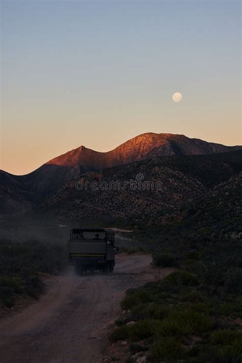 Vertical Shot Of Safari Truck At Sunset In The Aquila Nature Game