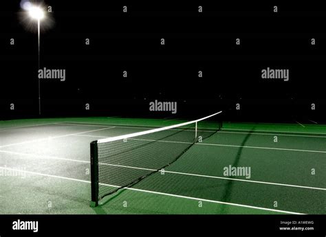 Tennis court by night Stock Photo - Alamy