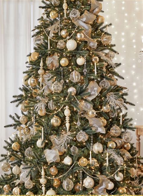 A Decorated Christmas Tree With Gold And Silver Ornaments