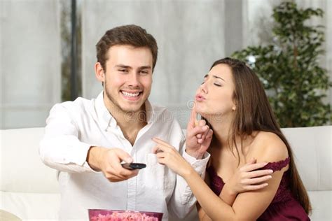 Husband Watching Online Content And Ignoring His Wife Stock Image