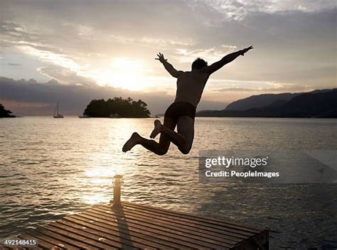 Man Diving Silhouette Photos And Premium High Res Pictures Getty Images