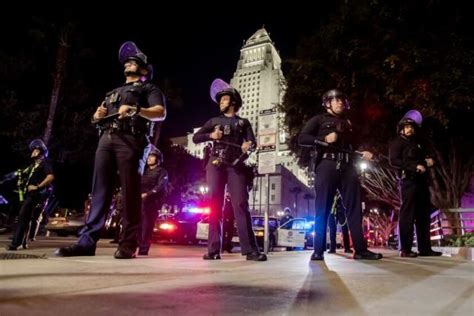 Lapd Officers In Riot Gear Face Off With Protesters After Release Of