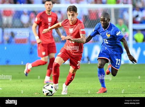 Kacper Urbanski Of Poland Pictured In A Duel With Ngolo Kante