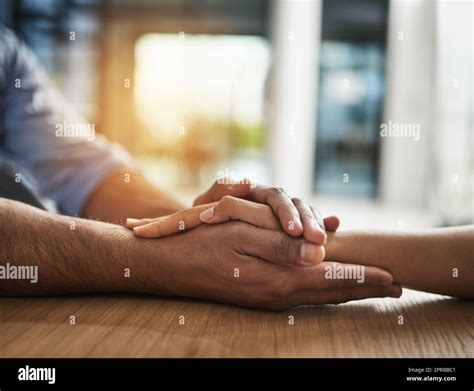 Kindness Support And Trust Between Two People Holding Hands While