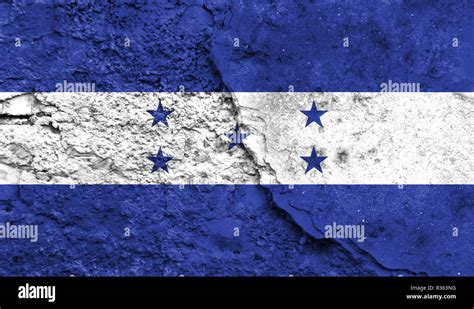 Flag Of Honduras Close Up Painted On A Cracked Wall Concept Of Armed