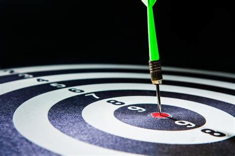 Premium Photo Green Dart Arrow Hitting In Target Center Of Dartboard