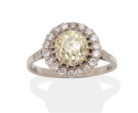 Yellow Diamond Cluster Ring With Platinum Mounting Rings Jewellery