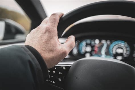 Car Driver Has His Hand On The Steering Wheel Stock Illustration