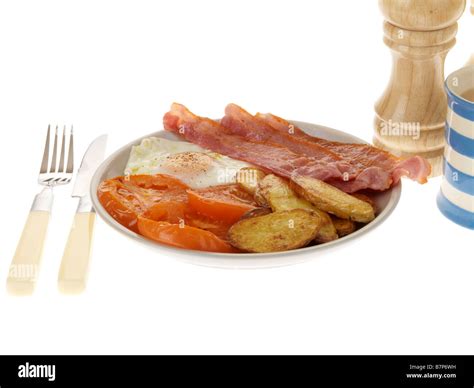 Cooked Breakfast With Streaky Bacon And Egg Stock Photo Alamy