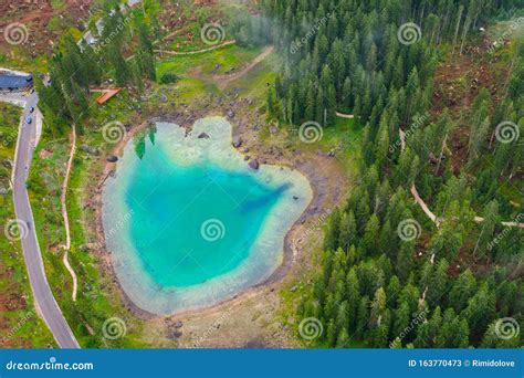 Aerial View Of Turquoise Blue Water Of Lake Carezza In Alps Dolomites