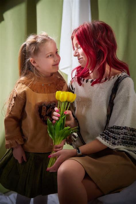 Amazing Pretty Mother And Daughter Having Fun With Flowers In 8 March