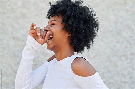 Young African American Woman Laughing By Stocksy Contributor Ivan