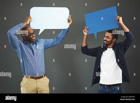 Men Holding Speech Bubbles For Social Media Communication Via Messaging