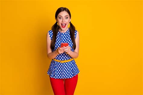 Premium Photo Portrait Of Astonished Positive Girl Use Smartphone